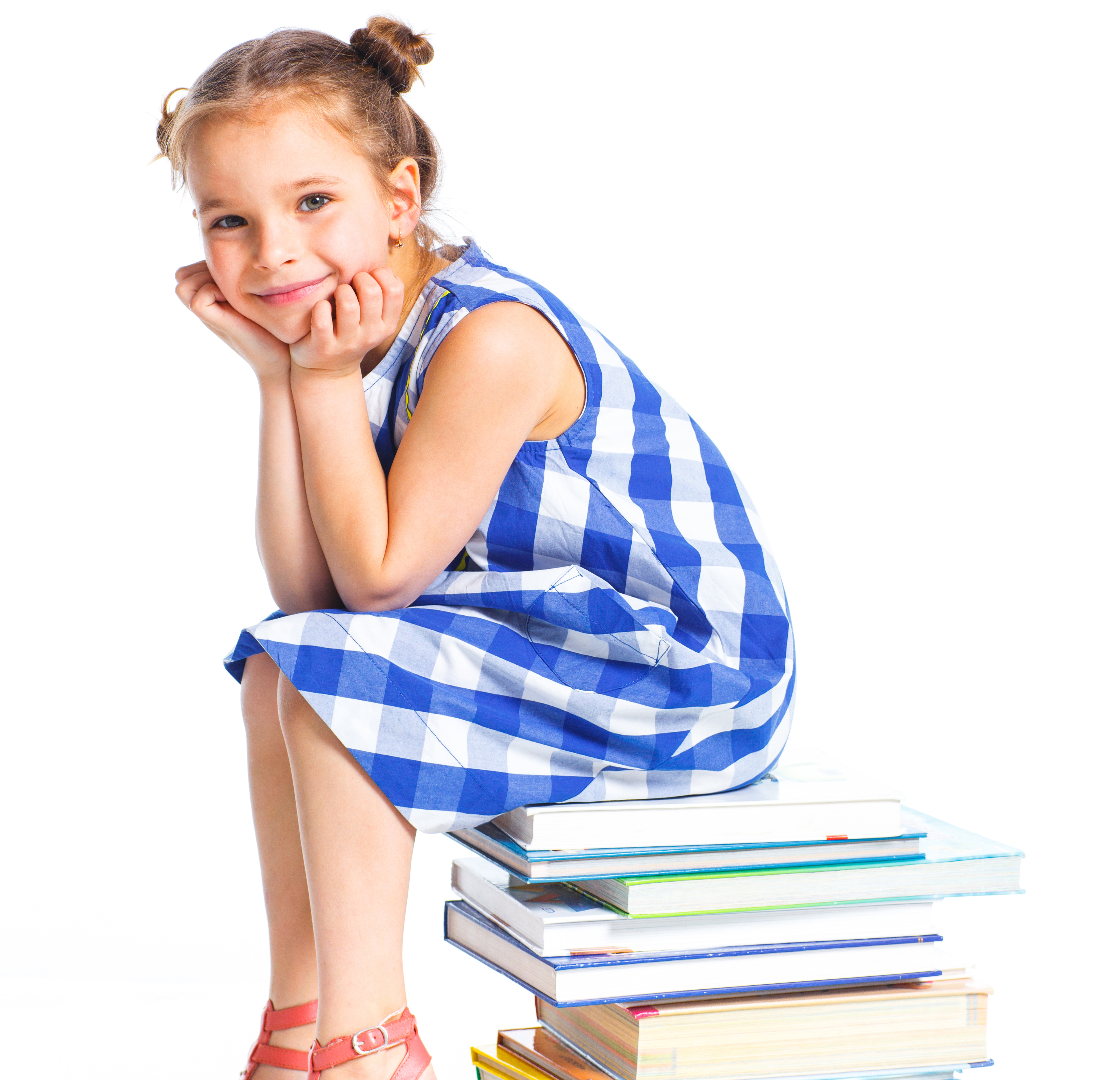 Child sitting on books