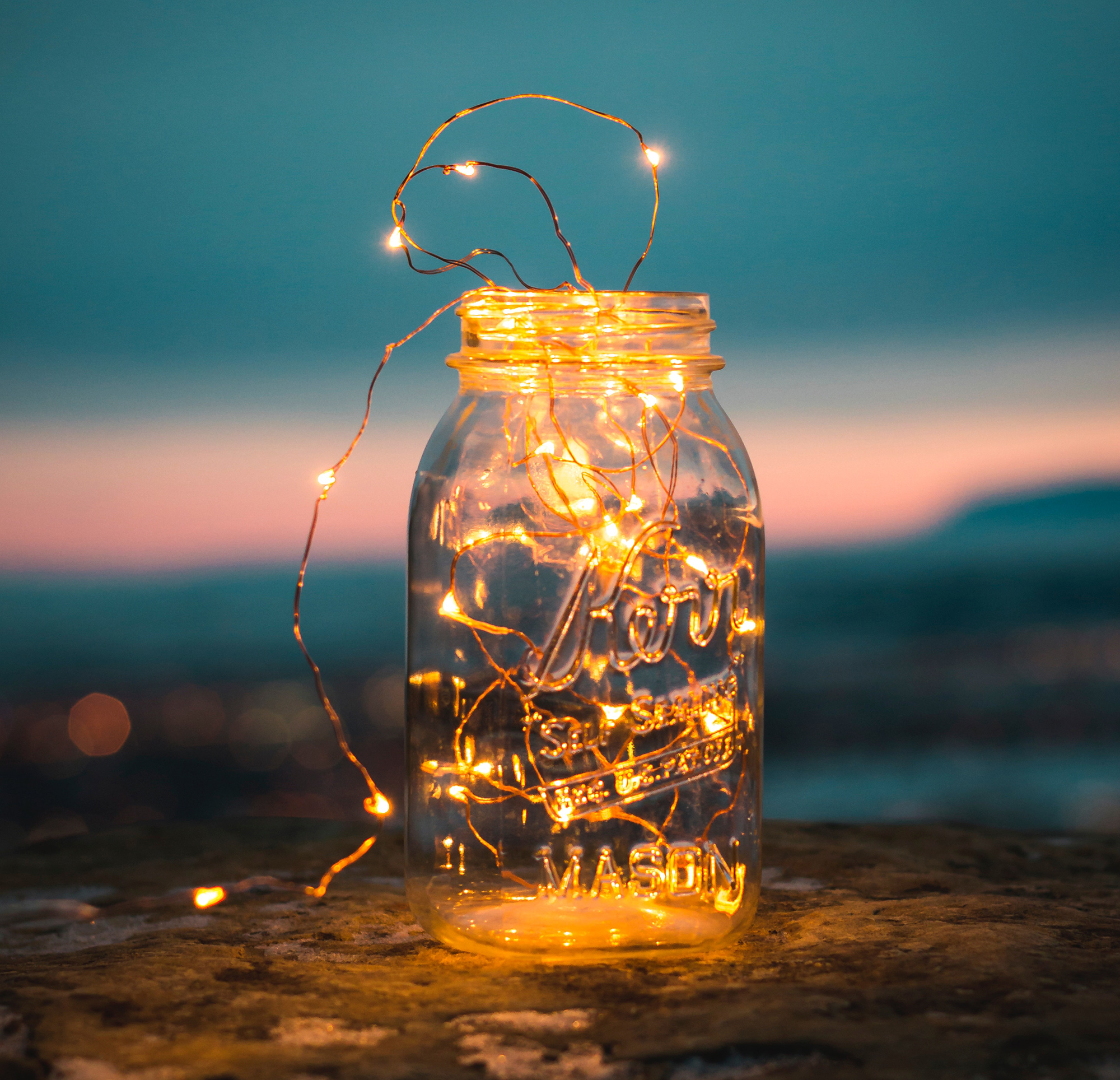 Photograph of a mason jar with led lights inside