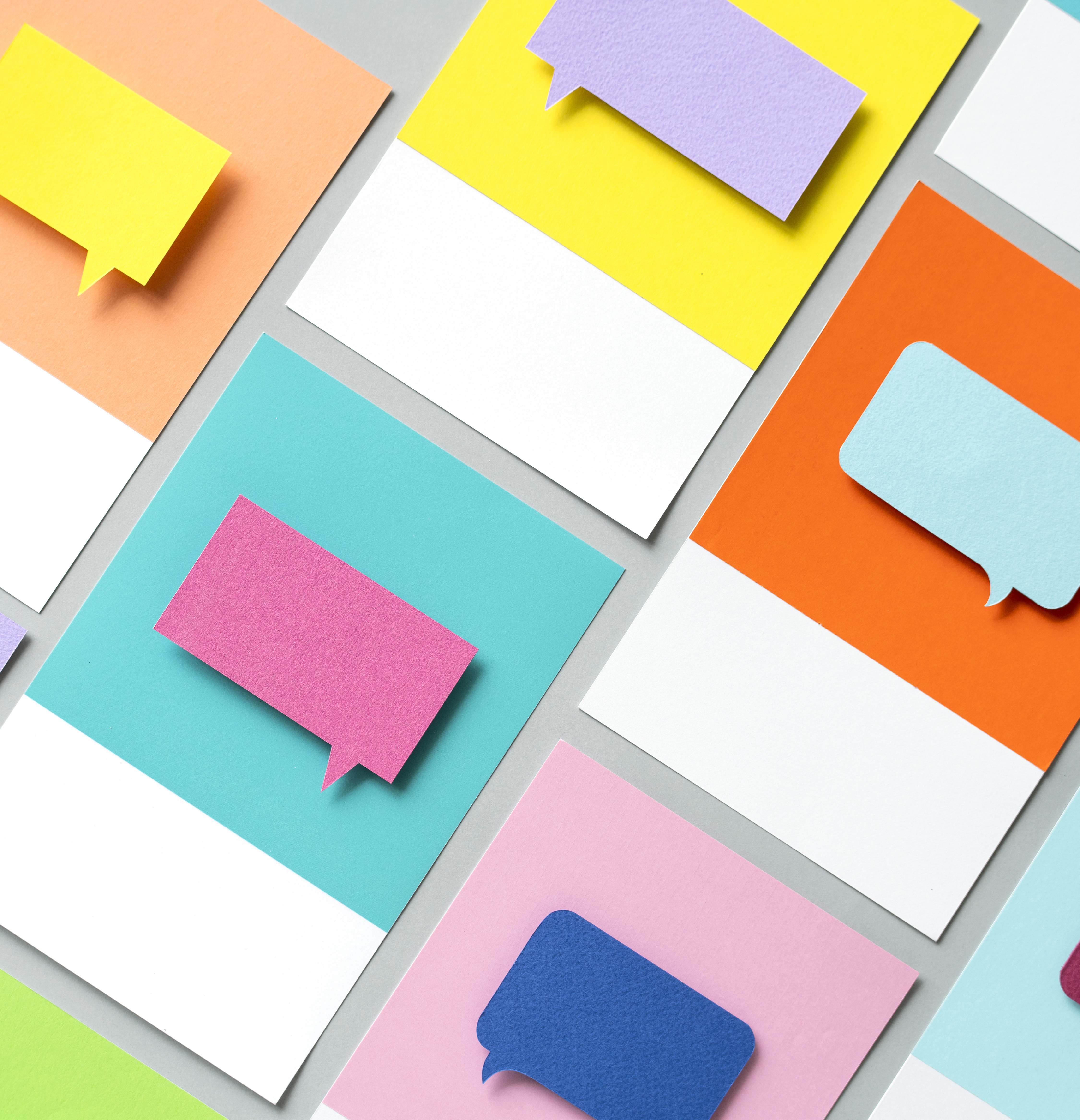 colourful post-it notes in the shape of speech bubbles