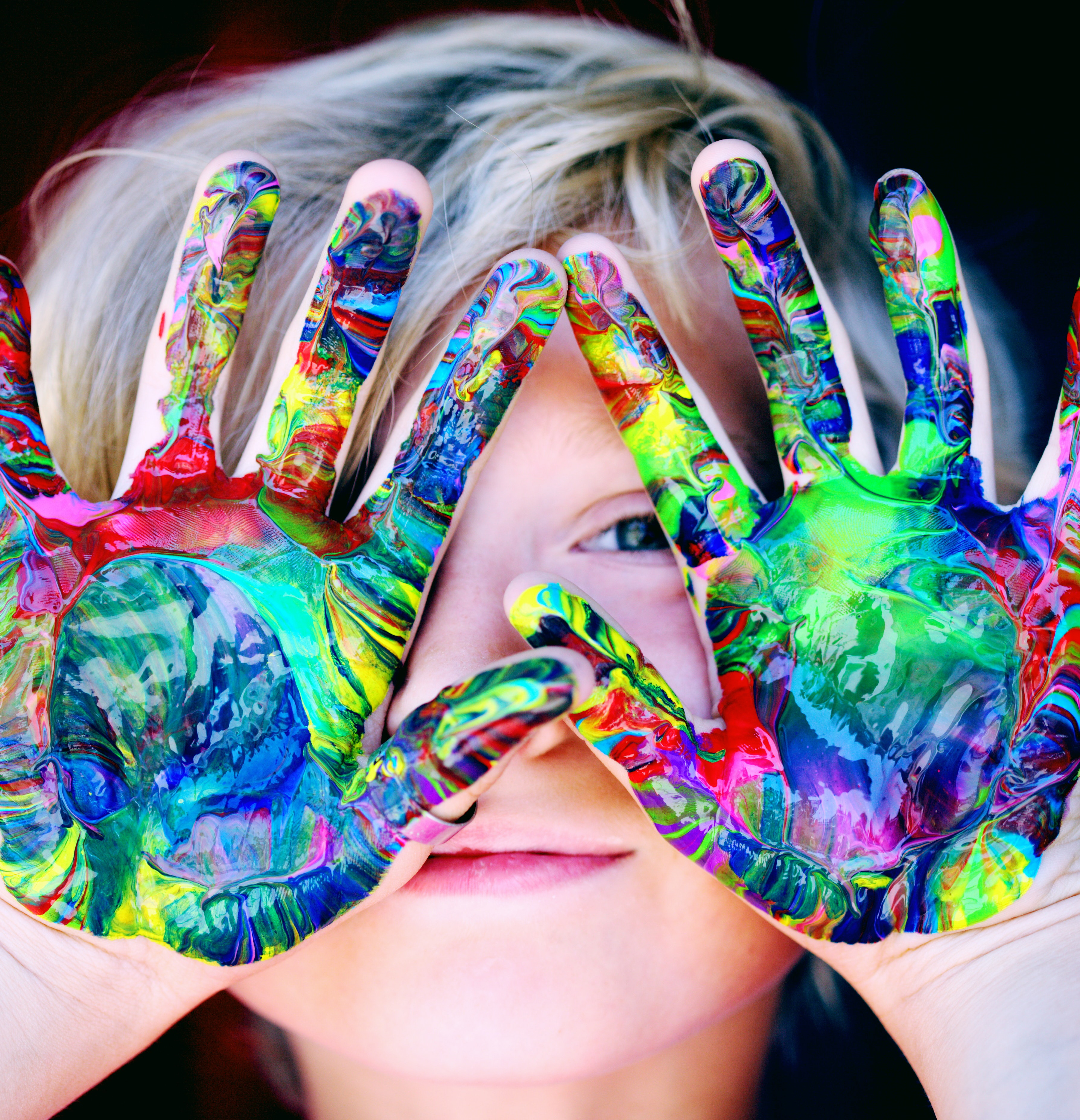 a child with paint on their hands