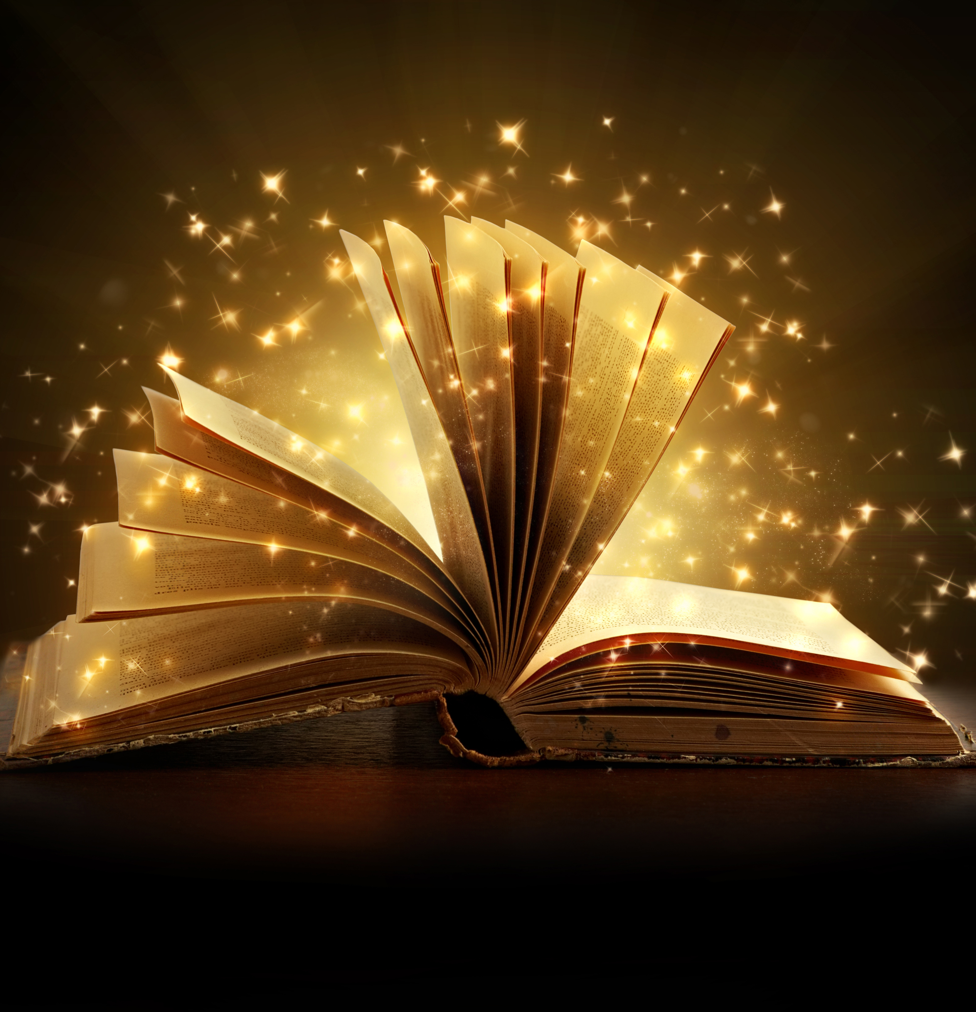 open book with sparks of light coming from the pages