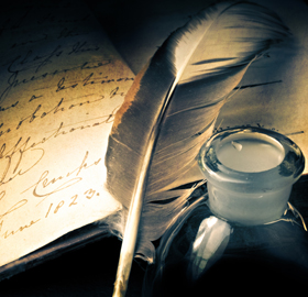quill with inkpot and notepaper