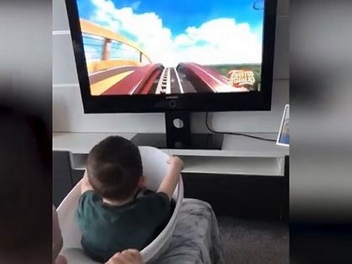 child watching roller coaster video