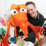 man holding a puppet