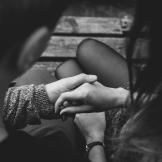 black and white holding hands