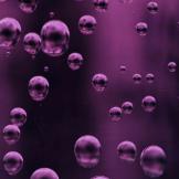 A picture of bubbles in a purple liquid