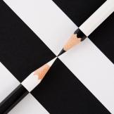 black and white pencils on striped background