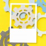 An illustration of various gears on a yellow background