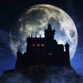 spooky mansion at night with full moon