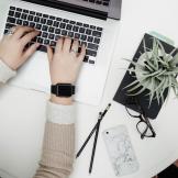 hands on a laptop