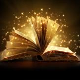 open book with sparks of light coming from the pages