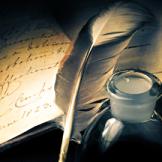 quill with inkpot and notepaper