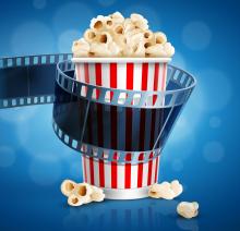 Image of a carton of popcorn wrapped in a film strip
